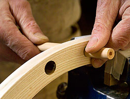 Hand making a chair