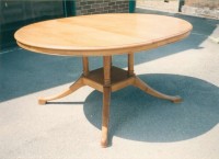 Four Column Pedestal Table with Skirt Moulding