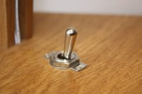Traditional toggle switch on lamp base